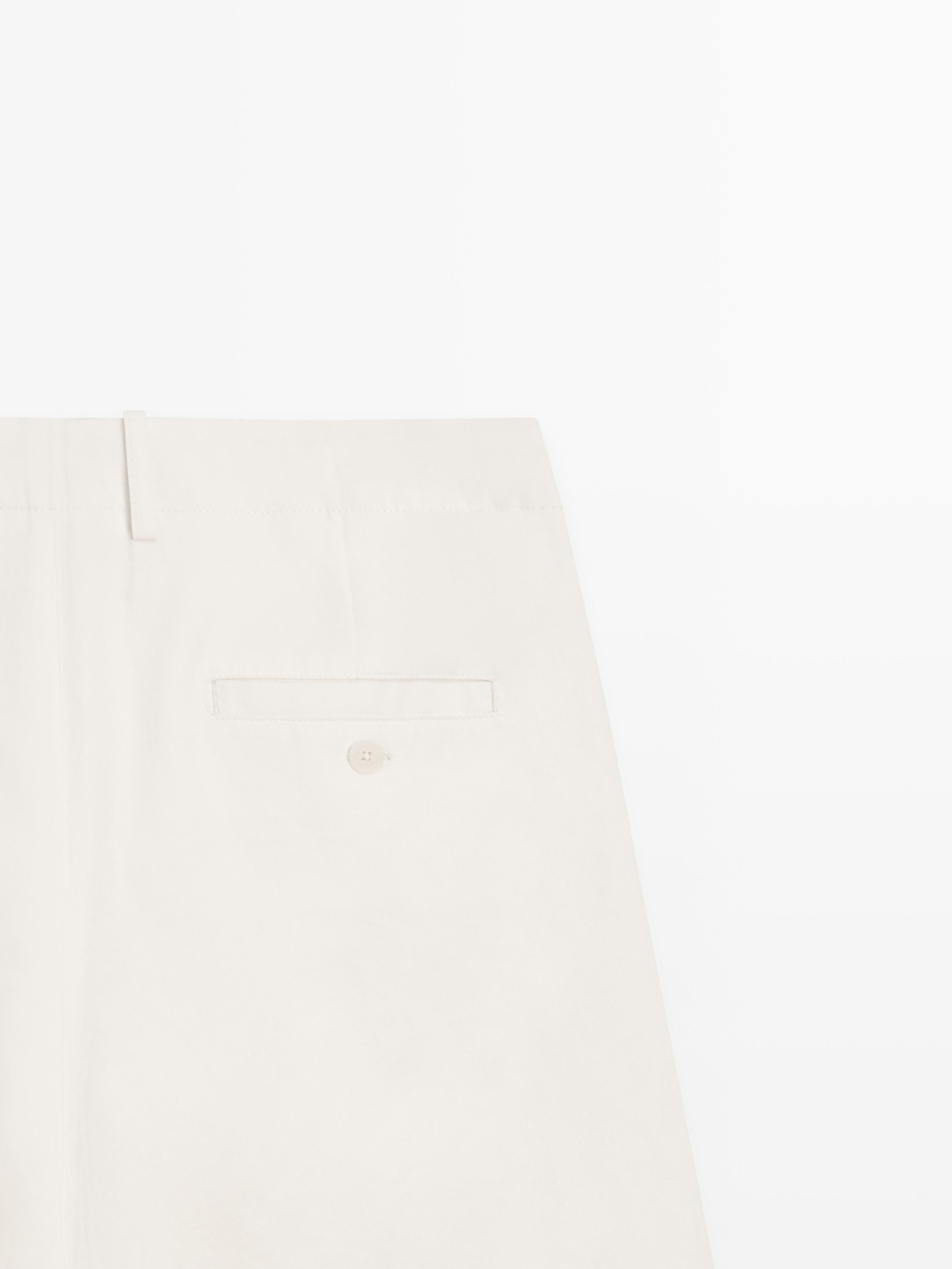 Pleated trousers with crossover fastening - STUDIO